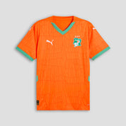 Orange sports jersey with green accents on a gray background