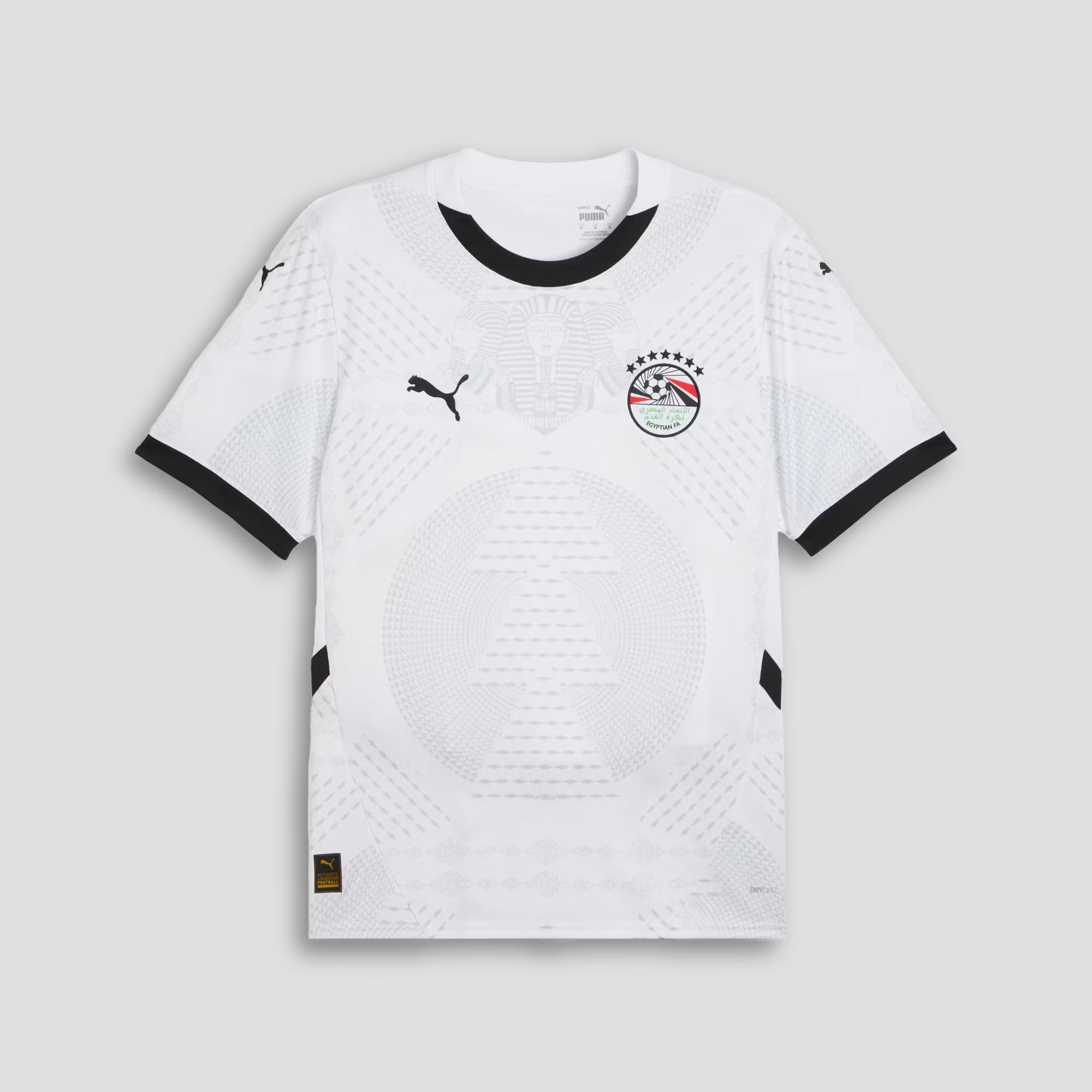 White sports jersey with black accents and brand logos on a light gray background