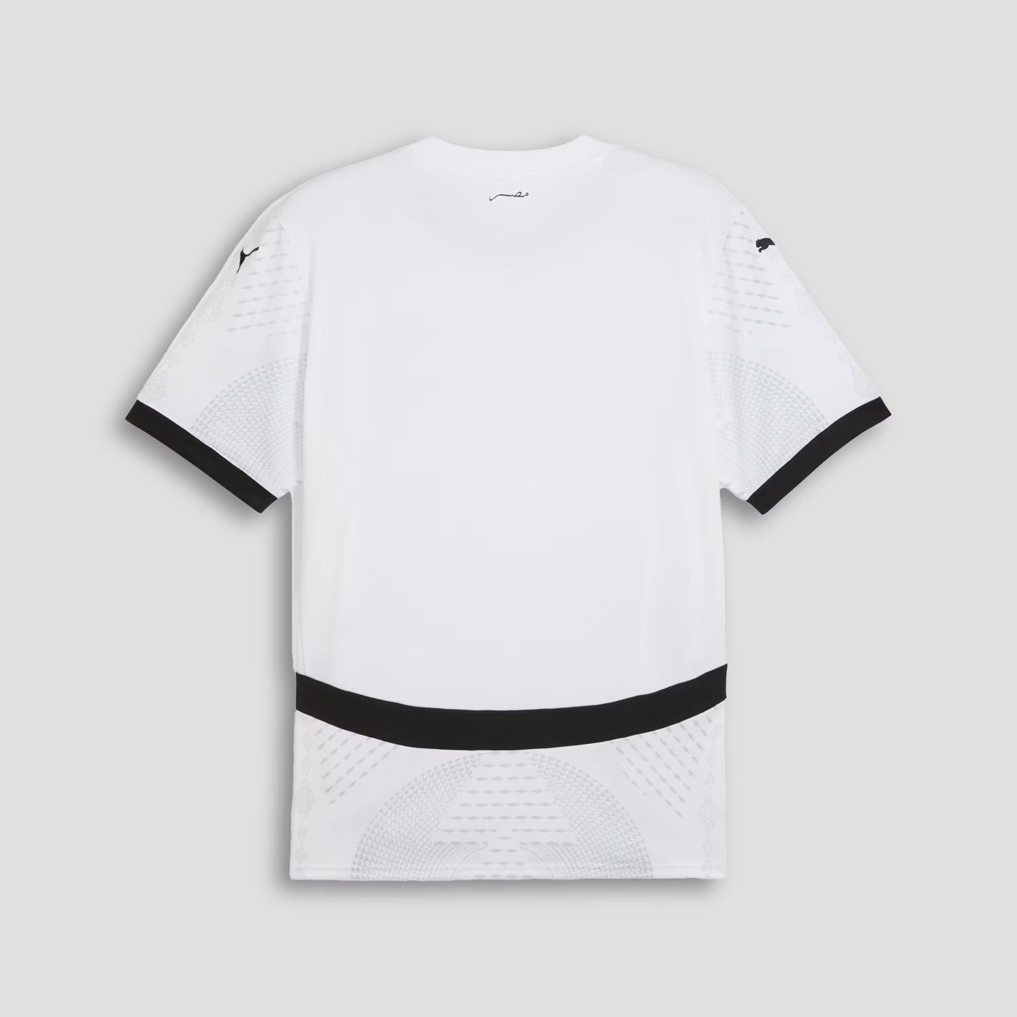 White t-shirt with black accents on a light gray background