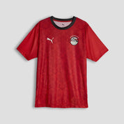Red sports jersey with Puma logo on a gray background