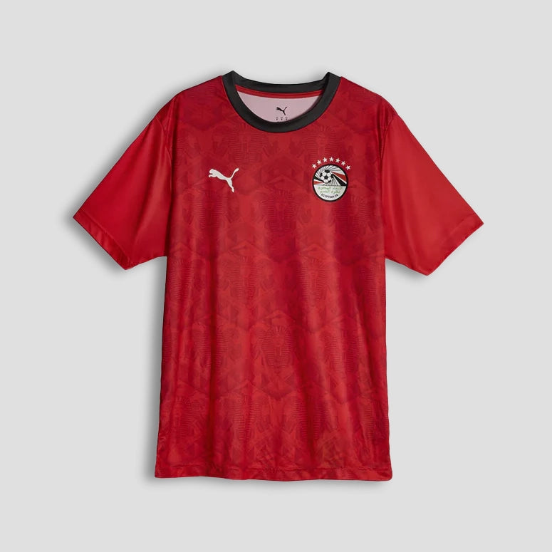 Red sports jersey with Puma logo on a gray background