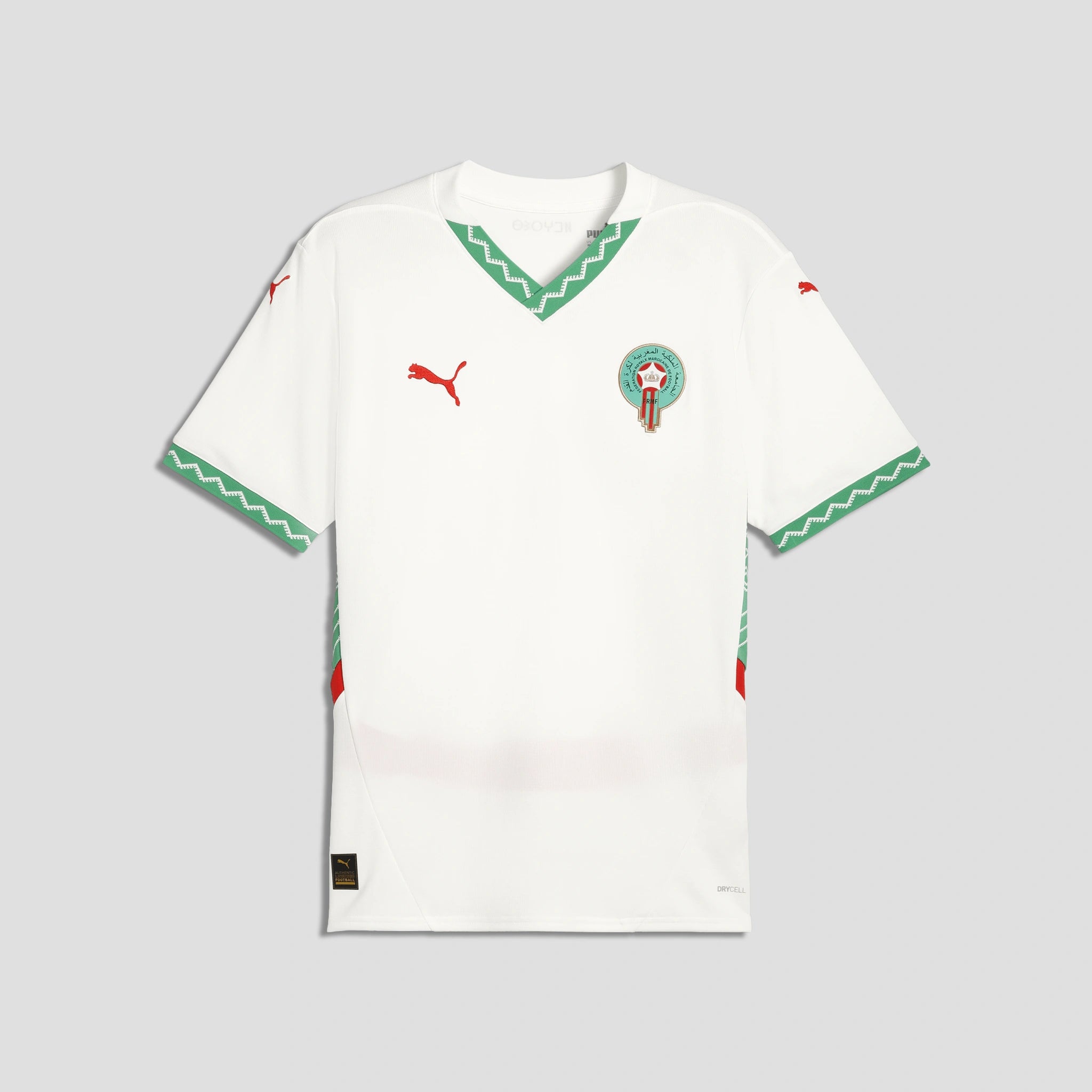White sports jersey with green and red accents on a light gray background