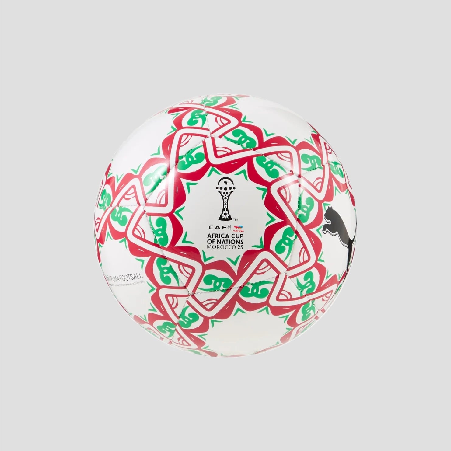 Soccer ball with red and green patterns on a gray background