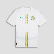 White t-shirt with colorful patterns and a logo on a light gray background