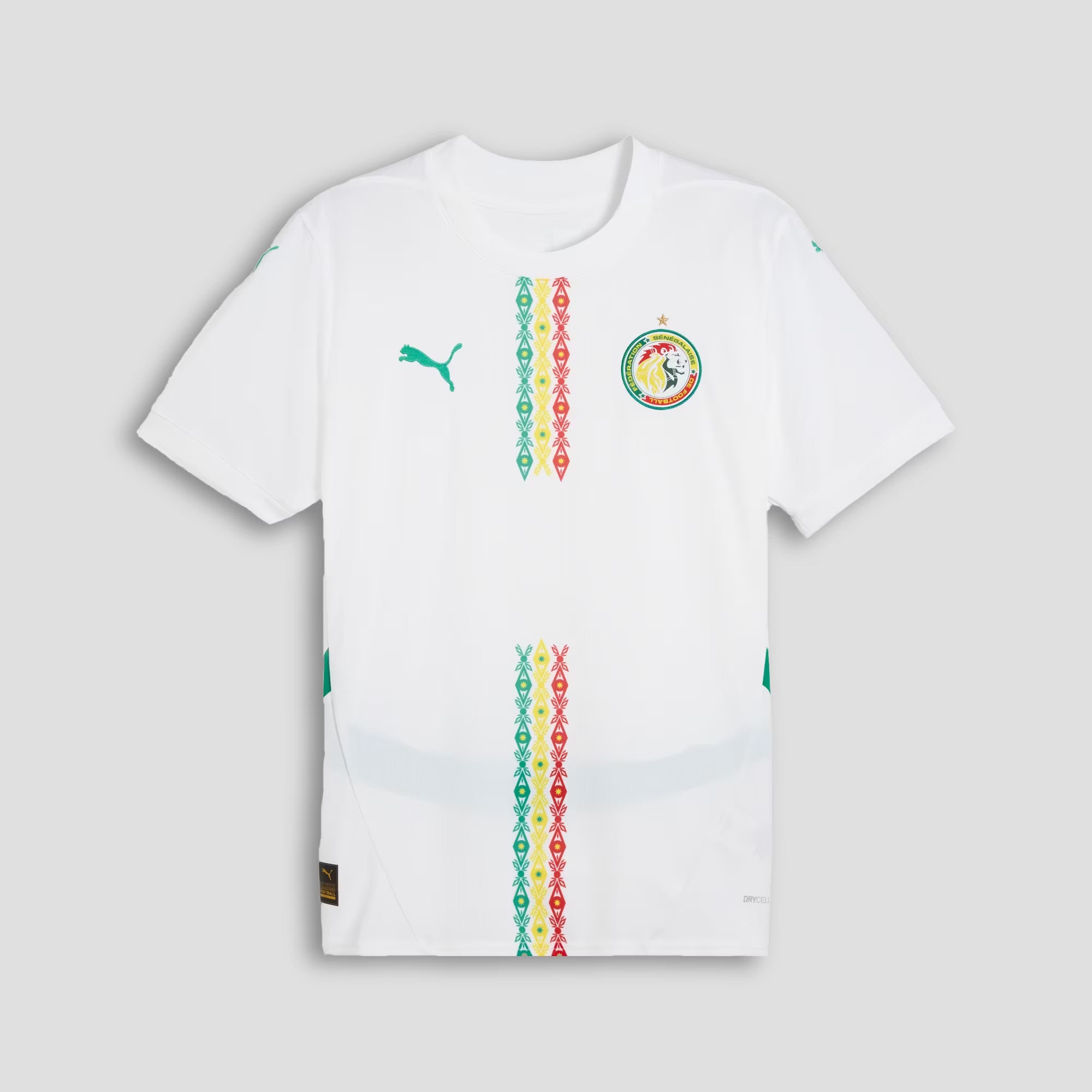 White t-shirt with colorful patterns and a logo on a light gray background