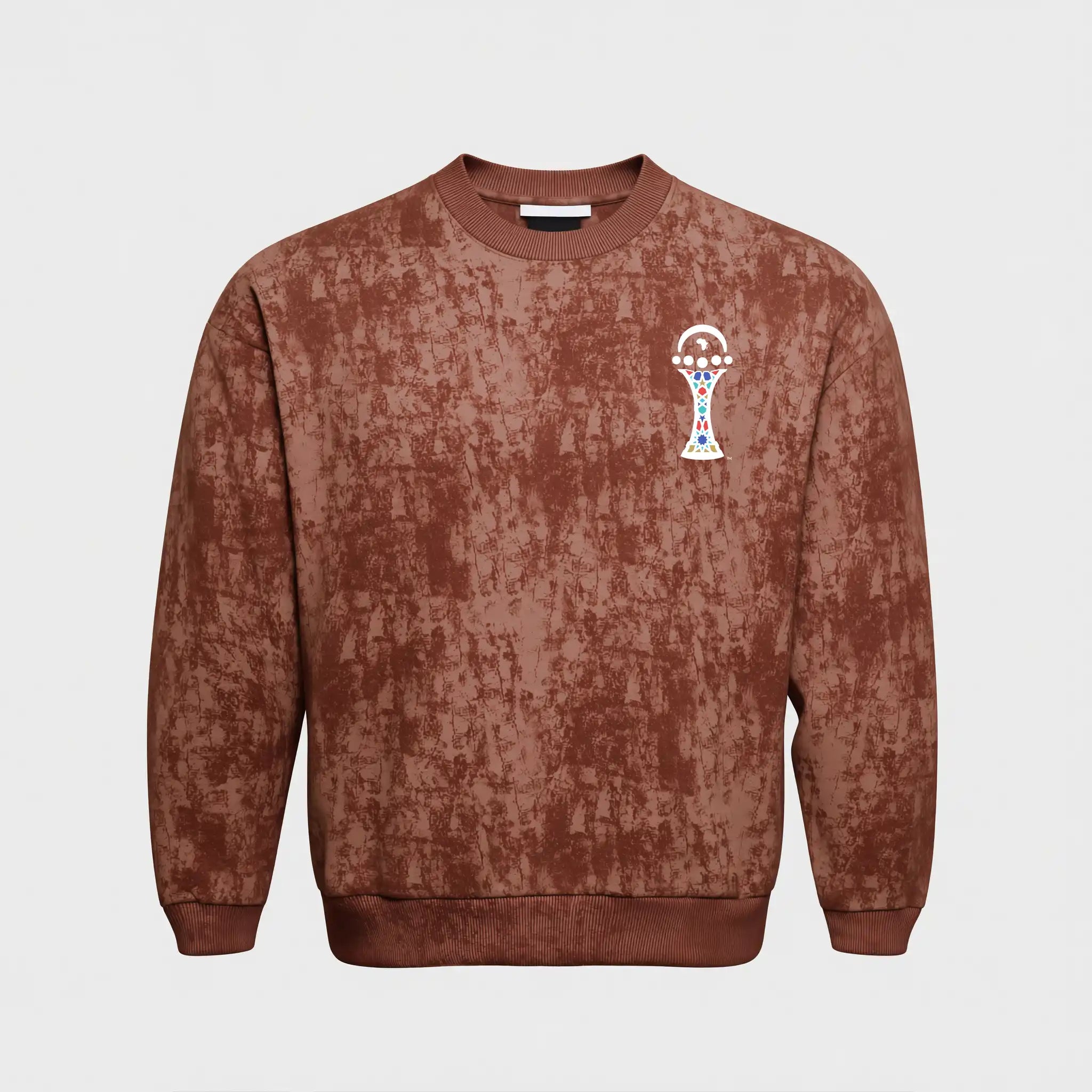 Brown distressed sweatshirt with a small logo on a light gray background